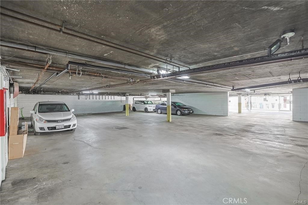 4406 Cahuenga Boulevard, Unit 202 Toluca Lake, CA 91602 - Photo 13 of 16 a view of parking garage with cars