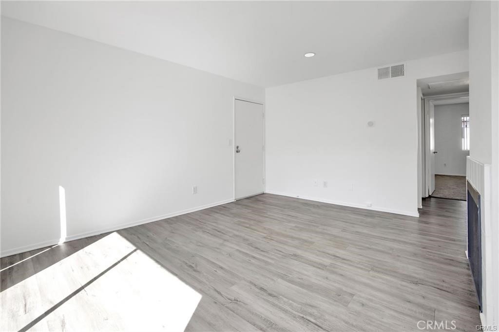 4406 Cahuenga Boulevard, Unit 202 Toluca Lake, CA 91602 - Photo 5 of 16 a view of an empty room and wooden floor