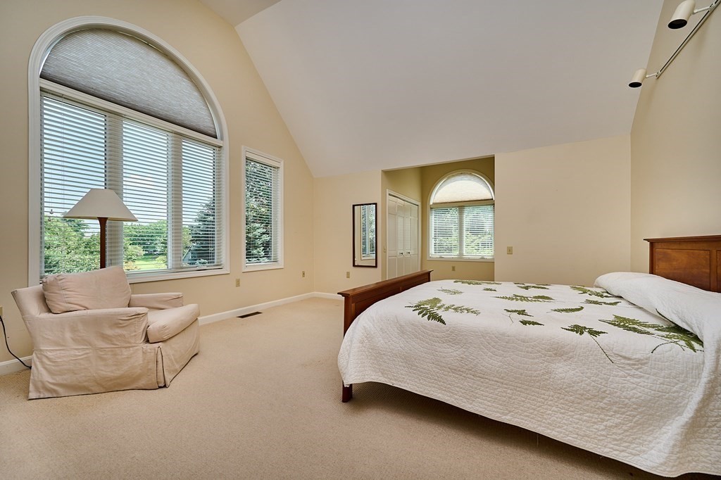 60 Country Corners Road Amherst, MA 01002 - Photo 16 of 42 a bedroom with a bed and a large window