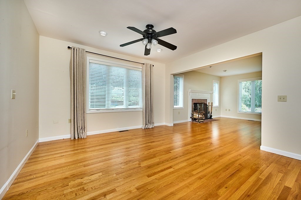 60 Country Corners Road Amherst, MA 01002 - Photo 8 of 42 a view of empty room with wooden floor and fan