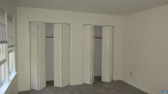 a view of a hallway with closet area