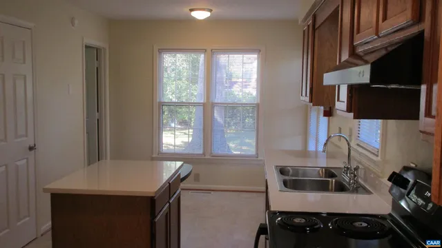 a kitchen with a stove and a sink