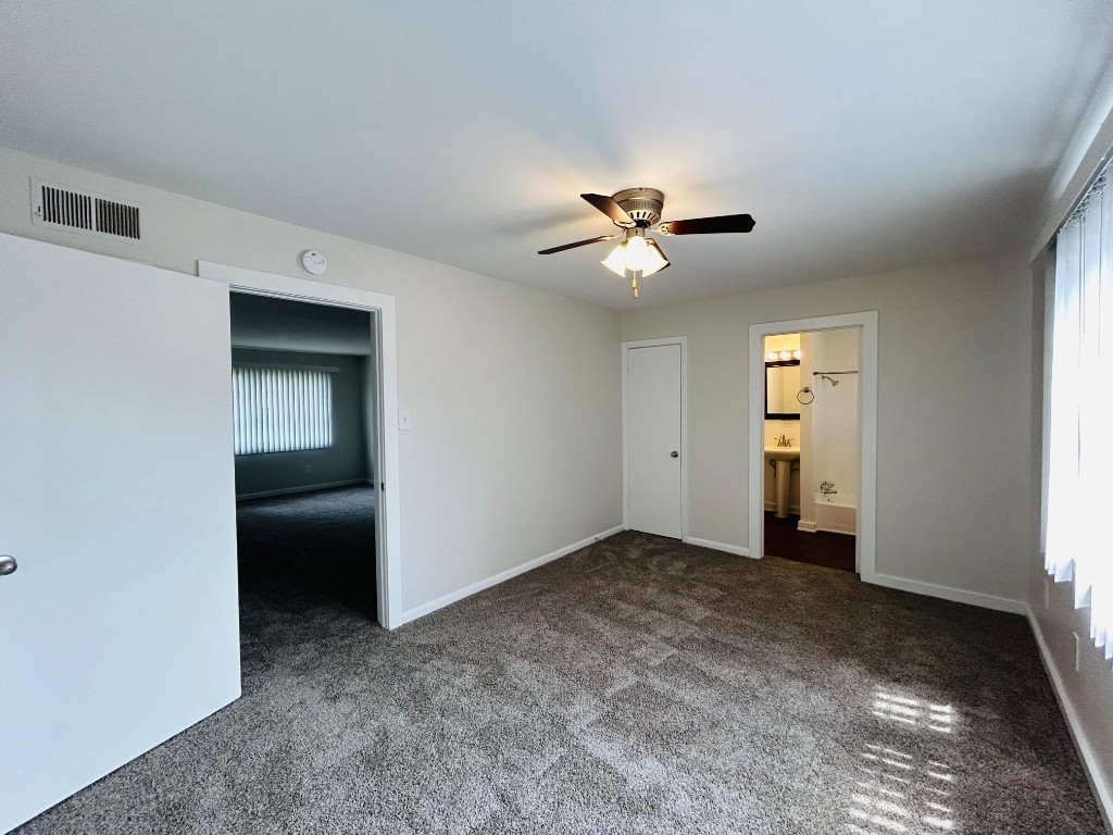 3629 North MacGregor Way, Unit 137 Houston, TX 77004 - Photo 11 of 15 wooden floor in an empty room with a window