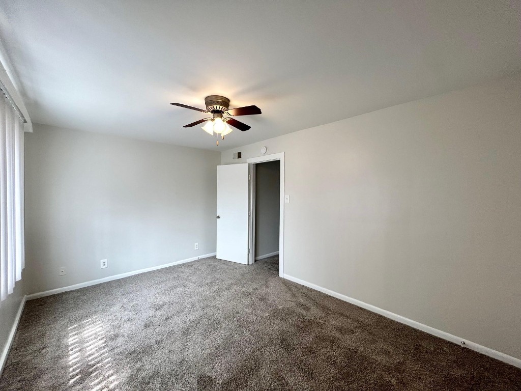 3629 North MacGregor Way, Unit 137 Houston, TX 77004 - Photo 12 of 15 a view of an empty room with a window