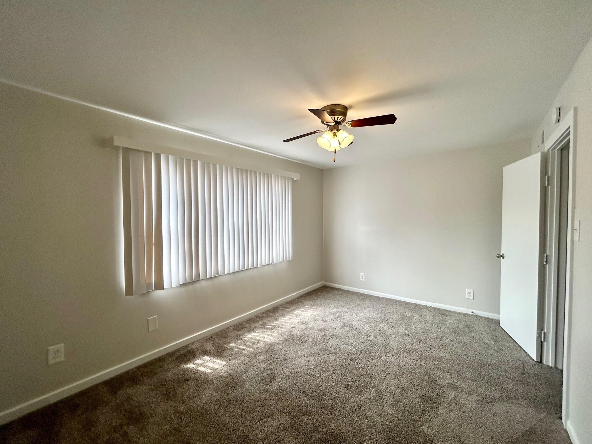 3629 North MacGregor Way, Unit 137 Houston, TX 77004 - Photo 13 of 15 a view of an empty room with a window