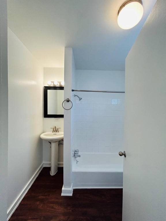 3629 North MacGregor Way, Unit 137 Houston, TX 77004 - Photo 14 of 15 a bathroom with a sink a mirror and a toilet