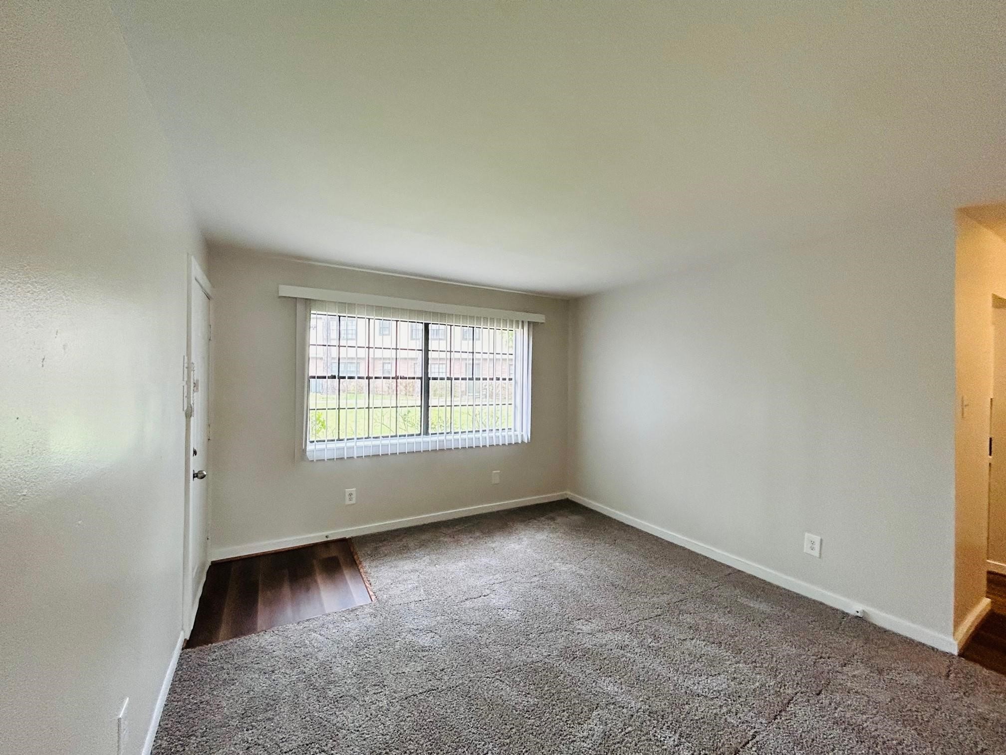 3629 North MacGregor Way, Unit 137 Houston, TX 77004 - Photo 3 of 15 an empty room with a window