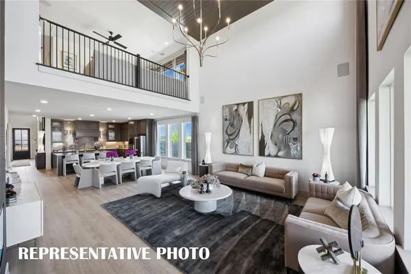 a spacious bedroom with bed and a chandelier