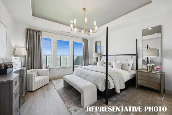 a bathroom with a sink mirror vanity and a bathtub