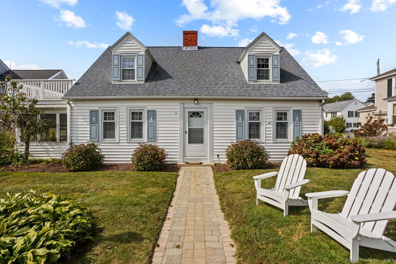 19 East Walk Clinton, CT 06413 - Photo 1 of 1 a front view of a house with garden