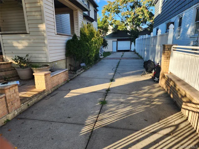 a balcony with table and chairs