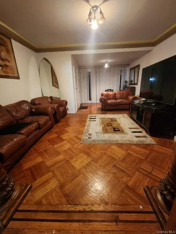 a bedroom with furniture and a flat screen tv