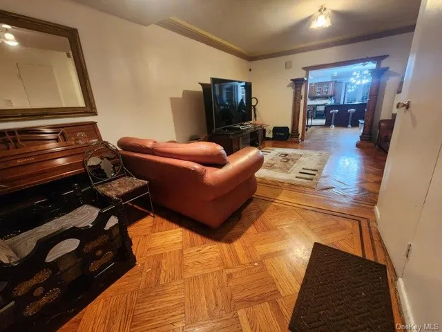 a living room with furniture and a flat screen tv