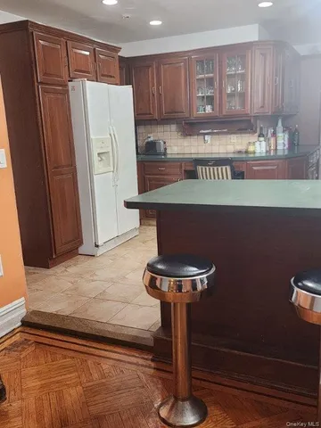 a bathroom with a toilet sink and shower curtain