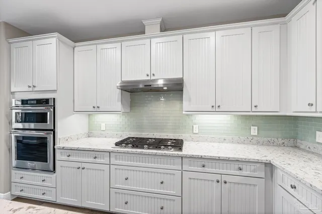 a view of a room with window wooden floor