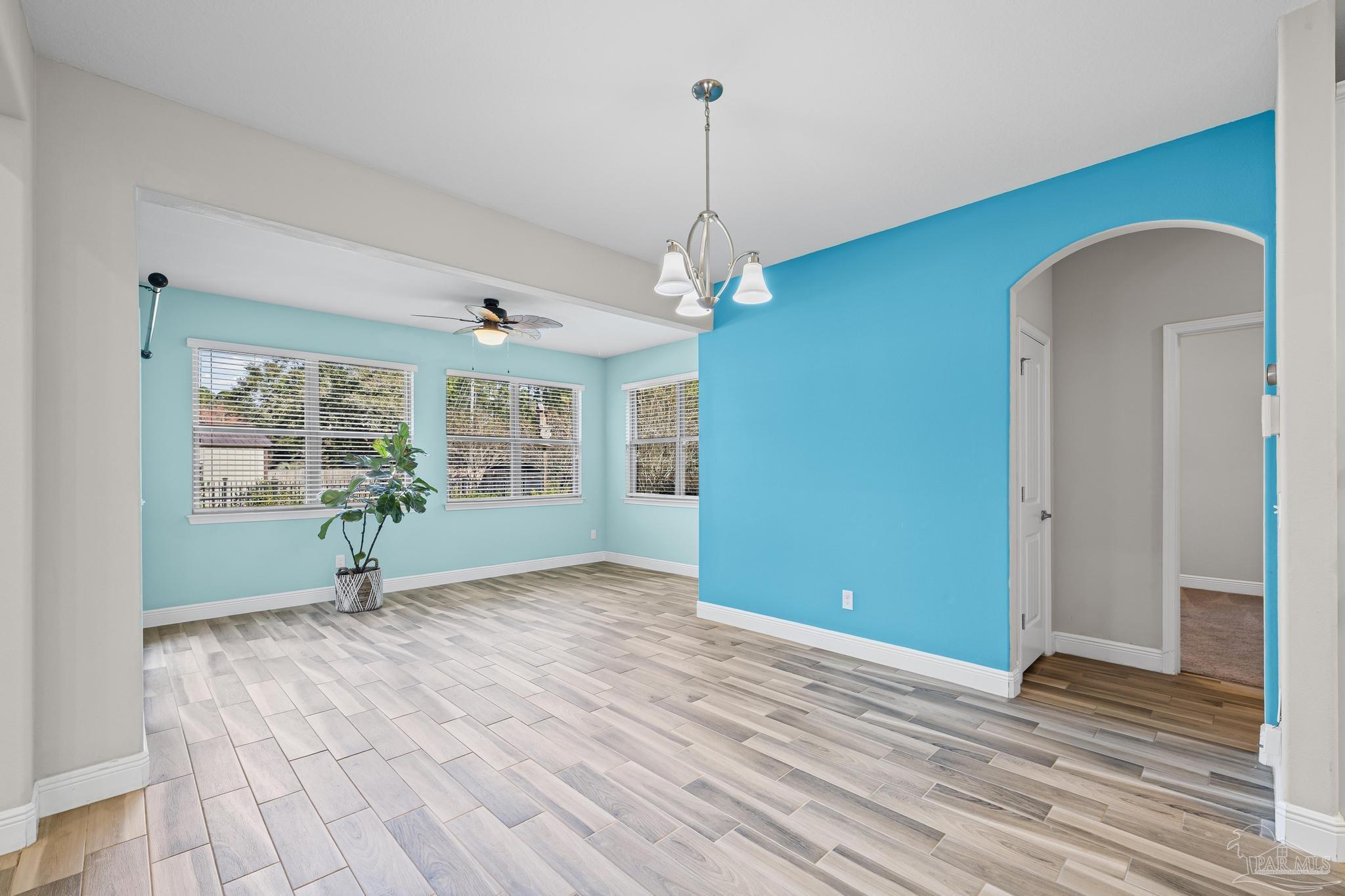 7166 Jasper Street Navarre, FL 32566 - Photo 22 of 71 a view of a room with window wooden floor