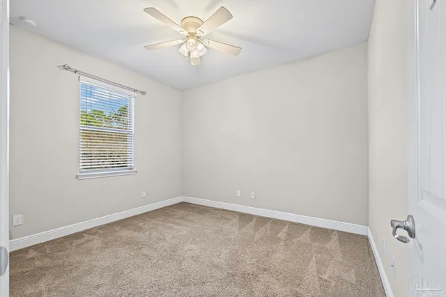 a bathroom with a granite countertop sink toilet a mirror and shower