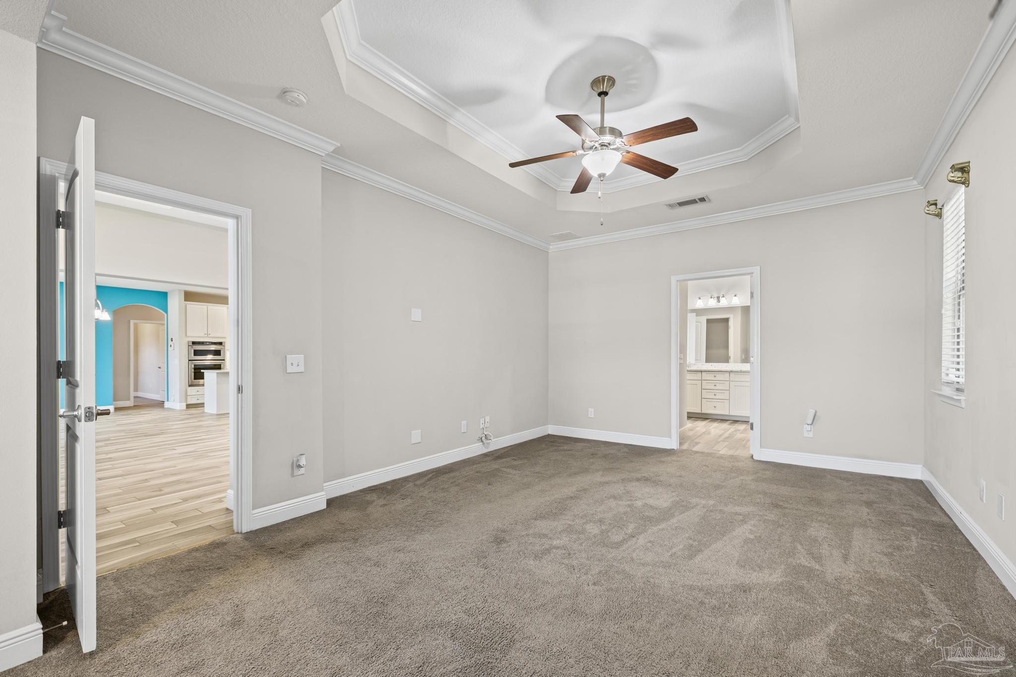 7166 Jasper Street Navarre, FL 32566 - Photo 36 of 71 wooden floor in an empty room with a window