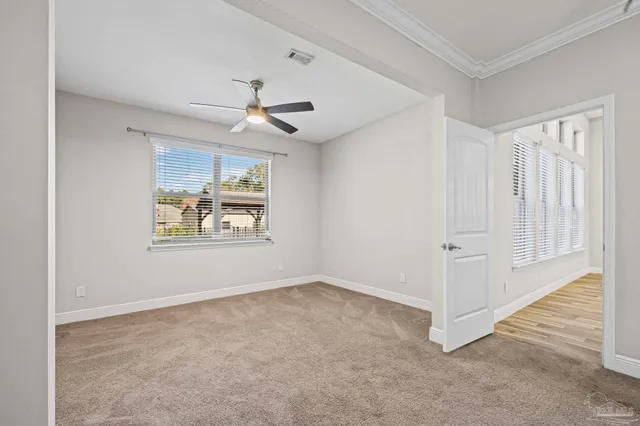 a view of a chairs and table in the backyard