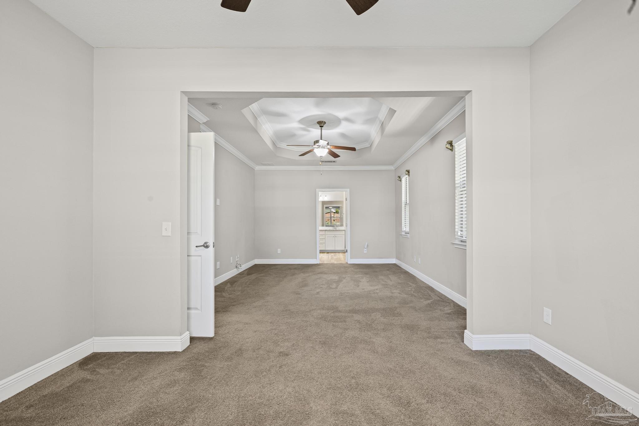 7166 Jasper Street Navarre, FL 32566 - Photo 39 of 71 an empty room that has a chandelier and a chandelier fan