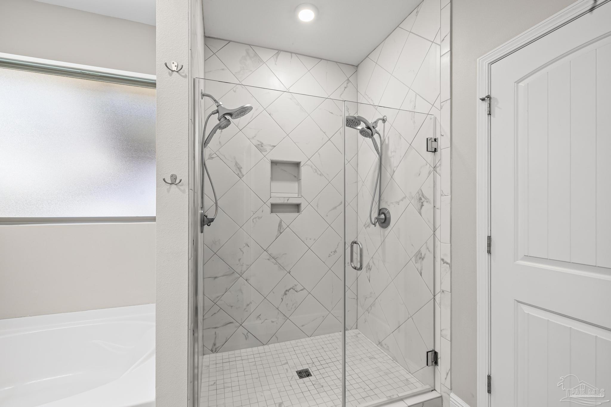 7166 Jasper Street Navarre, FL 32566 - Photo 41 of 71 a bathroom with a shower