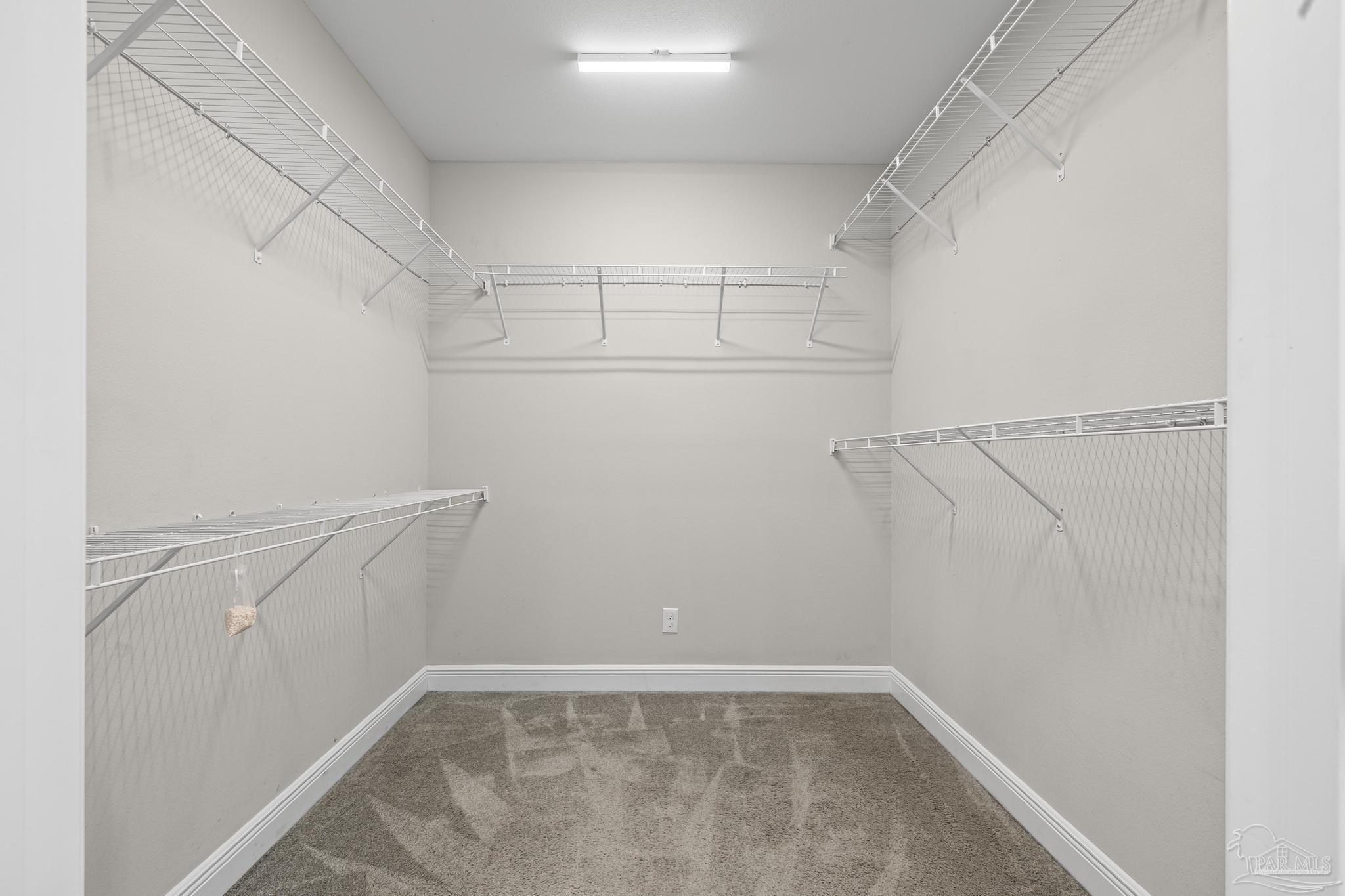 7166 Jasper Street Navarre, FL 32566 - Photo 43 of 71 a view of a room with racks on the wall
