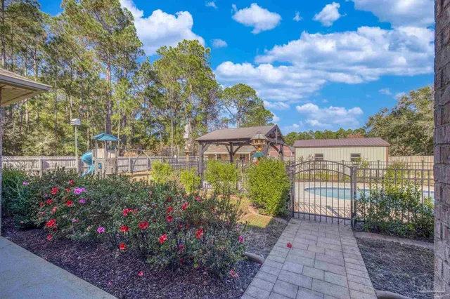 an aerial view of a house with a swimming pool
