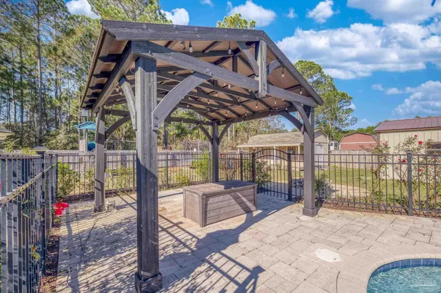 an aerial view of a houses with a yard