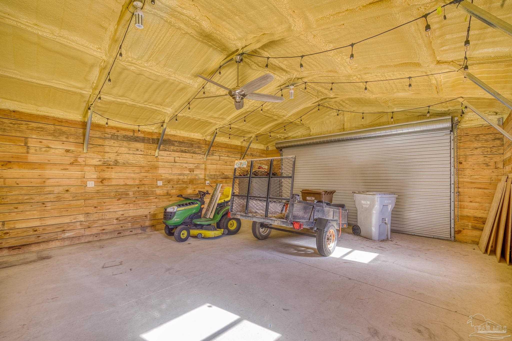 7166 Jasper Street Navarre, FL 32566 - Photo 61 of 71 a view of a patio with storage space