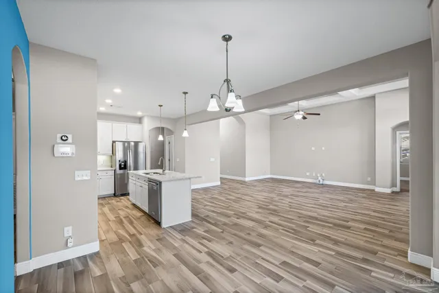 a kitchen with a sink stove and refrigerator