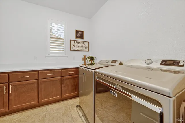 a bedroom with a large bed and a couch