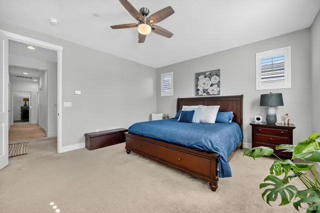 a bedroom with a bed closet and a window