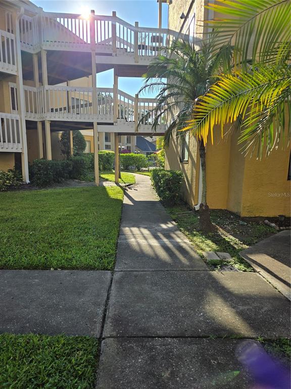 a view of a house with a yard