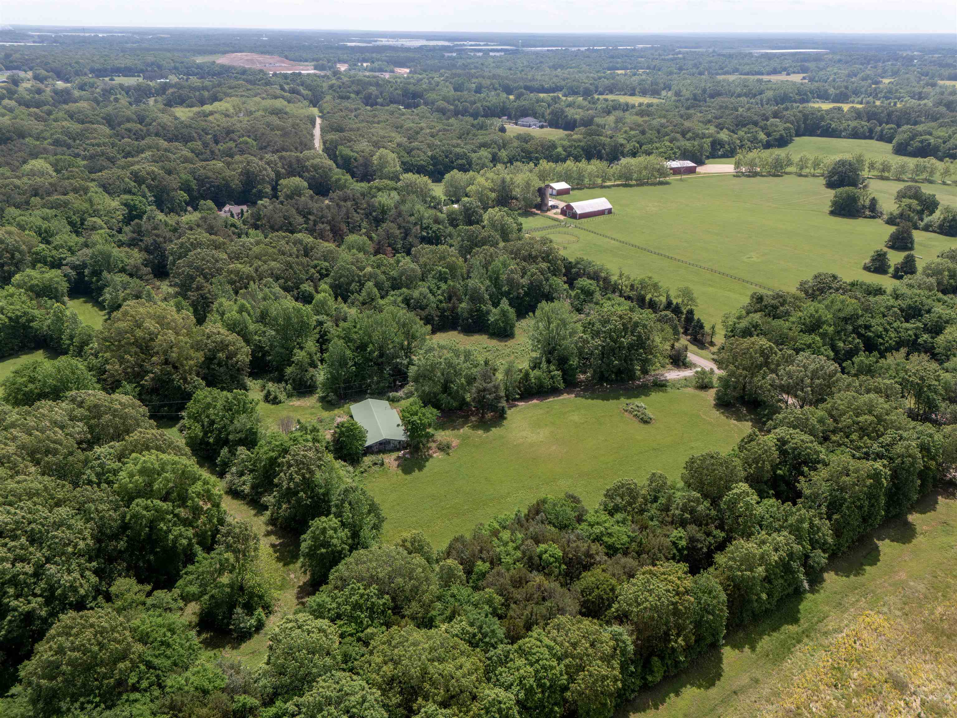 11620 East Holmes Road Collierville, TN 38017 - Photo 11 of 12 Aerial view of sparsely populated area featuring a forest