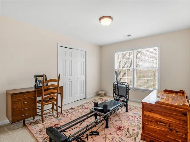 a bedroom with furniture and a window