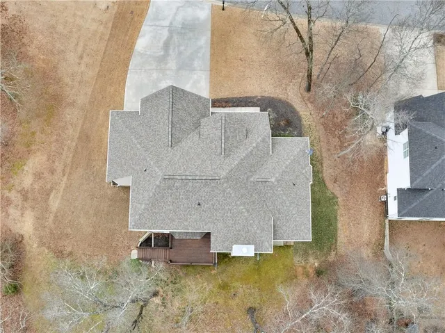 a view of a stone house with a yard