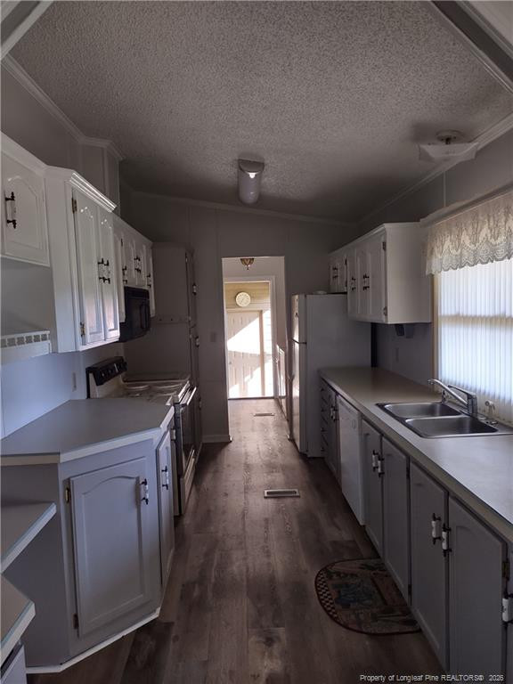 6331 Rennert Road Shannon, NC 28386 - Photo 3 of 4 a kitchen with a sink stove and cabinets