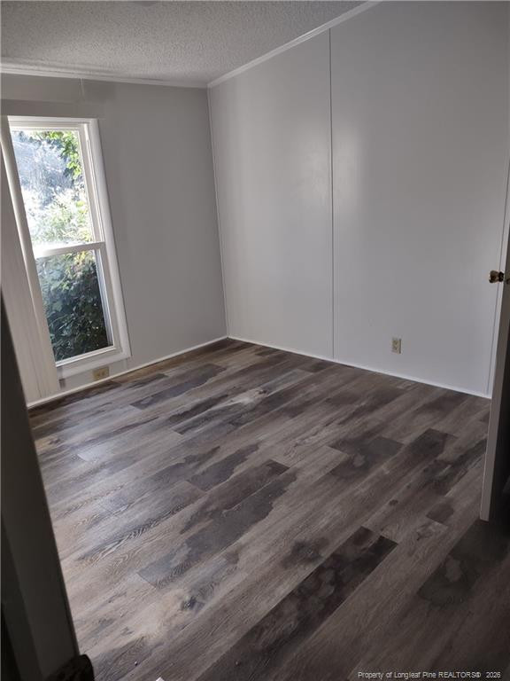 6331 Rennert Road Shannon, NC 28386 - Photo 4 of 4 a view of an empty room with wooden floor and a window