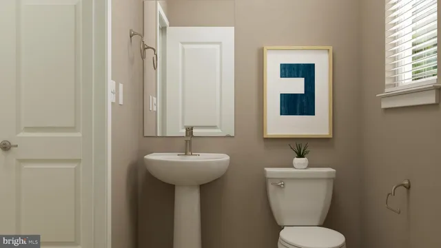 a room with furniture and a potted plant