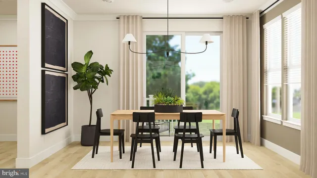 a dining room with furniture potted plants and wooden floor