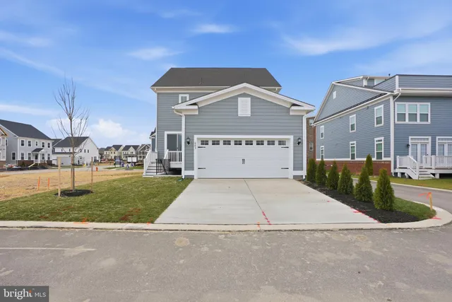 a front view of a building with a yard