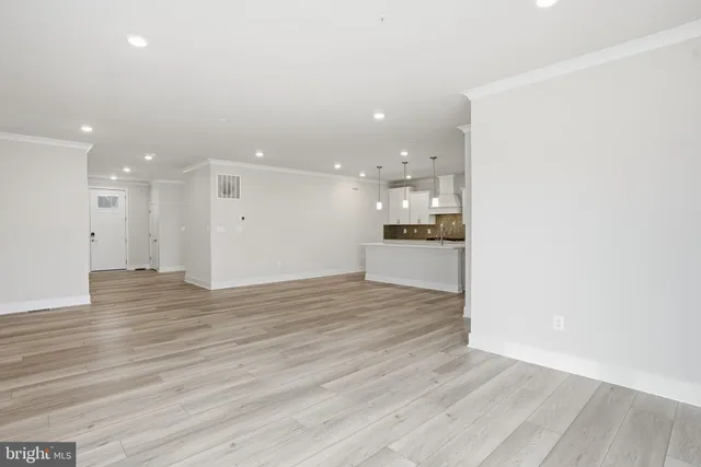 an empty room with wooden floor