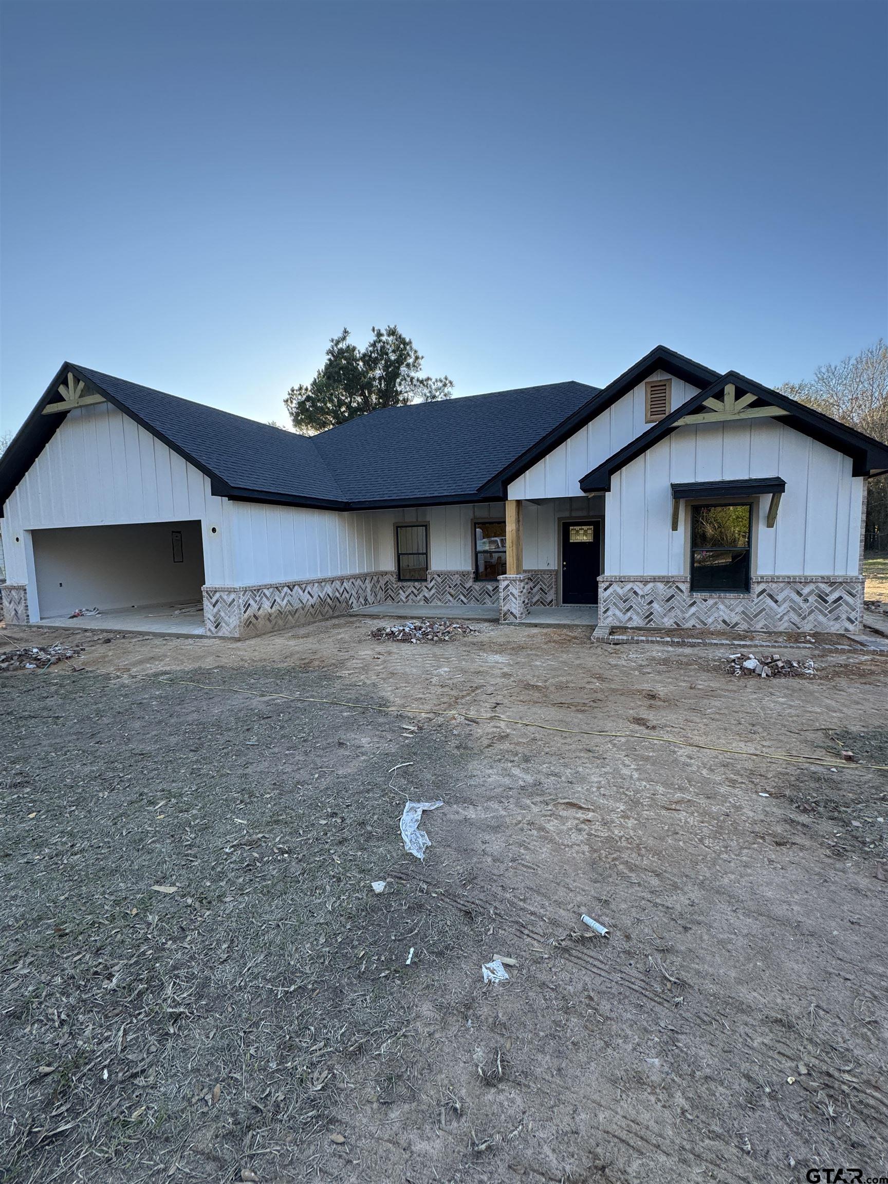 7235 County Road 485 Tyler, TX 75706 - Photo 2 of 4 a front view of a house with a yard