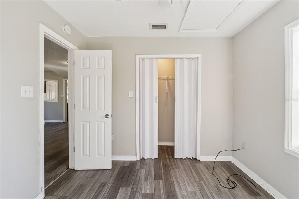 40542 West 3rd Avenue Umatilla, FL 32784 - Photo 11 of 13 wooden floor in an empty room