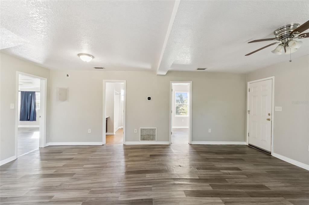 40542 West 3rd Avenue Umatilla, FL 32784 - Photo 12 of 13 a view of empty room with wooden floor