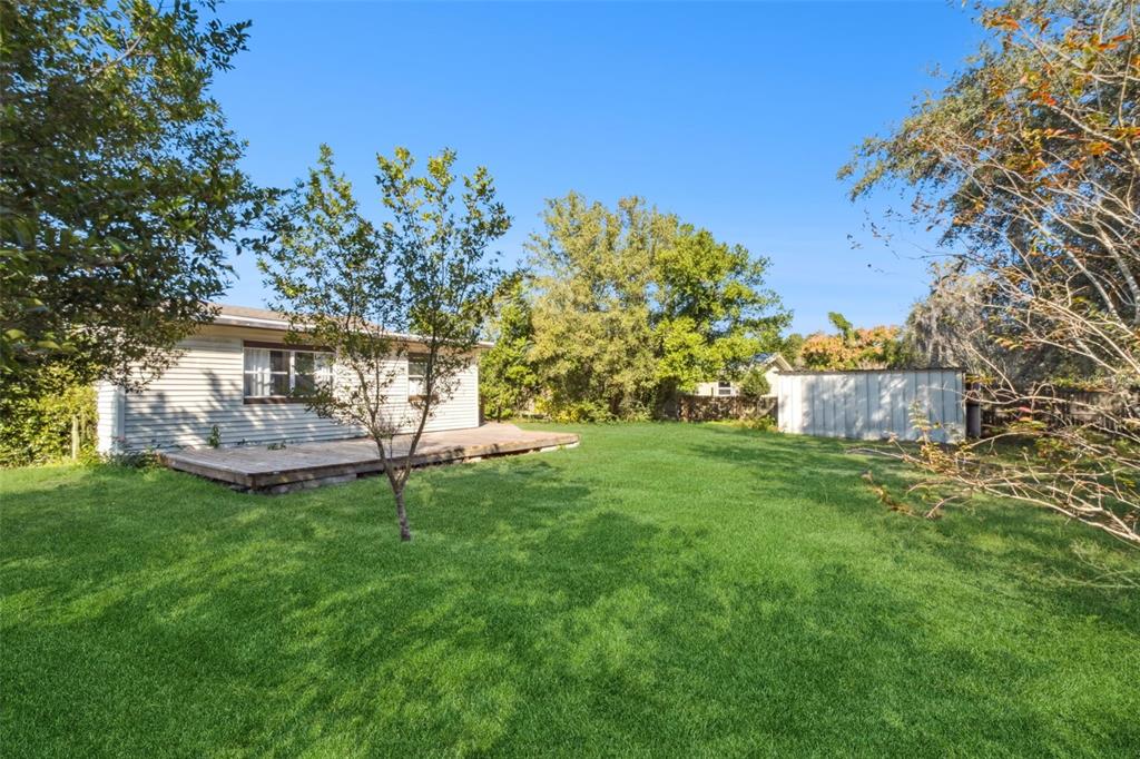 40542 West 3rd Avenue Umatilla, FL 32784 - Photo 13 of 13 a view of a house with backyard and a sitting area