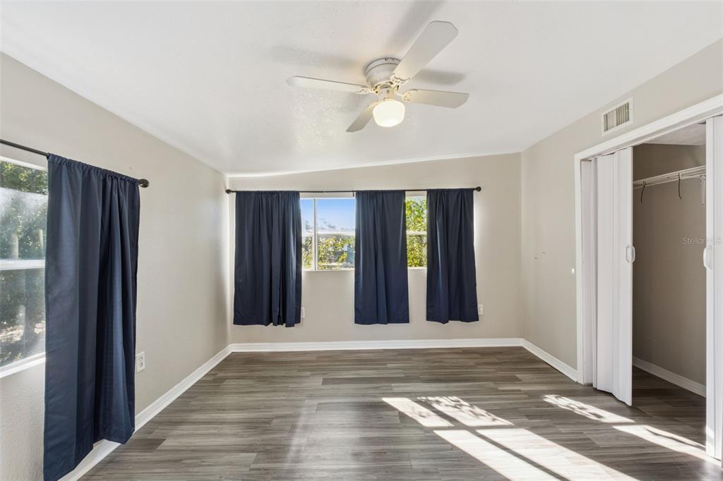 40542 West 3rd Avenue Umatilla, FL 32784 - Photo 10 of 13 a view of a hallway with wooden floor and staircase