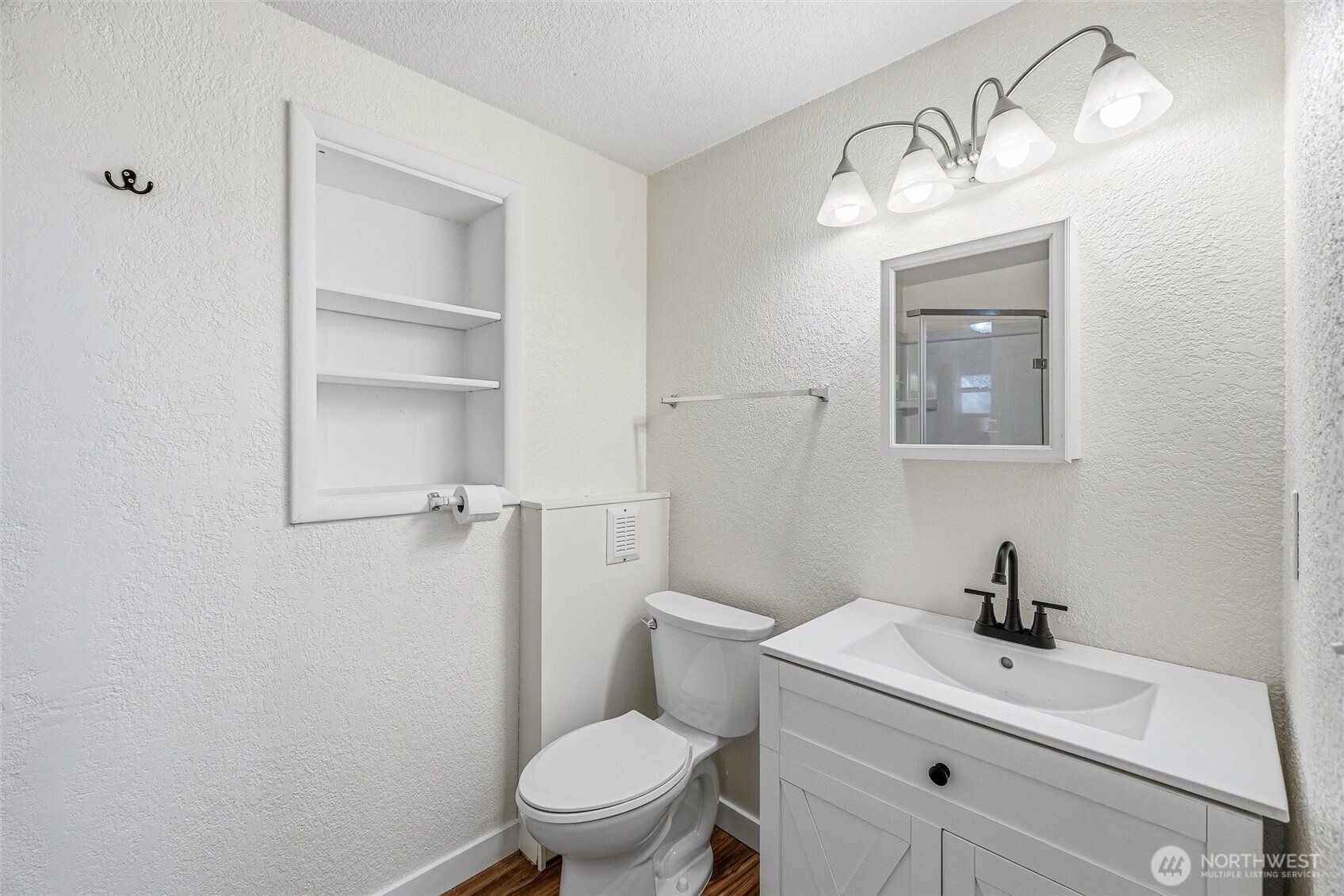 113 South Gardner Road Burlington, WA 98233 - Photo 38 of 40 a bathroom with a toilet a sink and mirror
