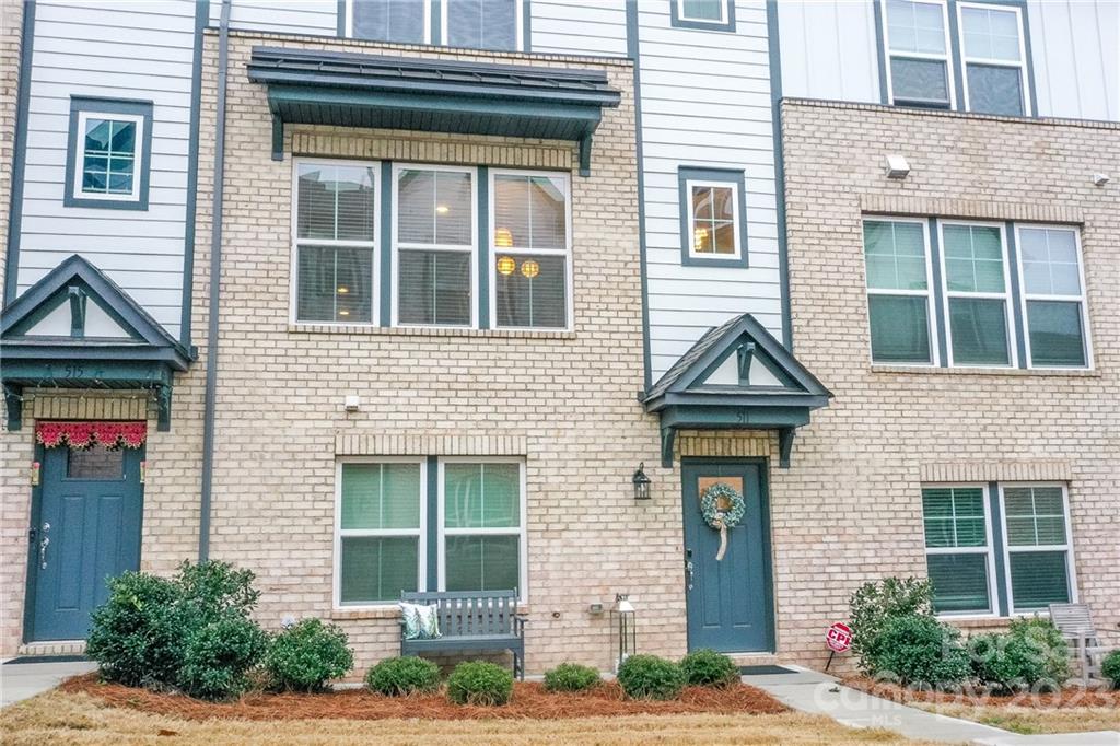 511 Upper Stone Circle Charlotte, NC 28211 - Photo 1 of 32 a front view of a house with plants