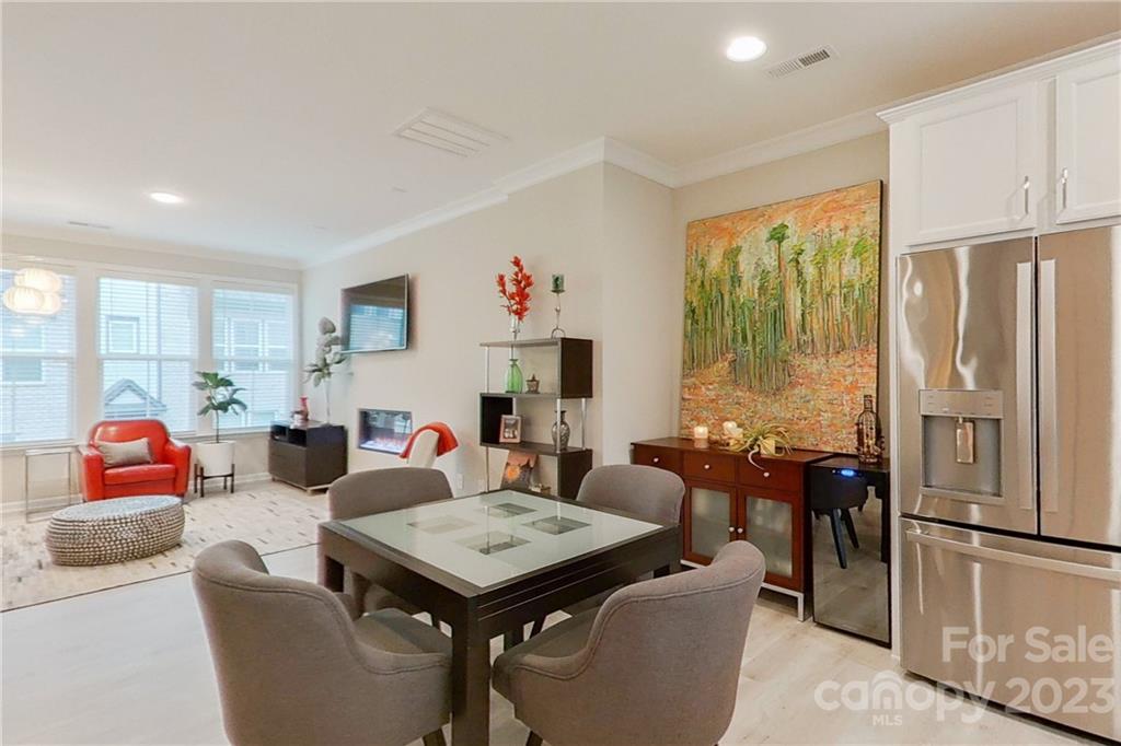 511 Upper Stone Circle Charlotte, NC 28211 - Photo 12 of 32 a living room with furniture a table and chairs